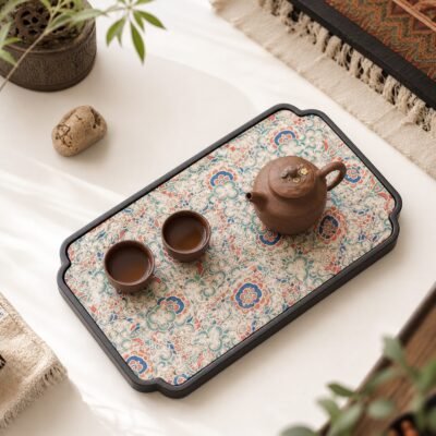 Brocade Bamboo Tea Tray with teapot and teacups on a floral patterned surface