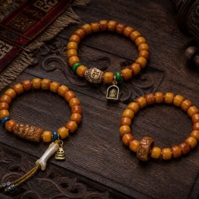 amber-carved-accent-prayer-bracelet-main Carved Accent Prayer Bracelet with amber-tone barrel beads and carved focal style