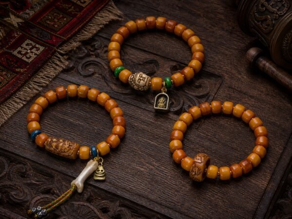 amber-carved-accent-prayer-bracelet-main Carved Accent Prayer Bracelet with amber-tone barrel beads and carved focal style