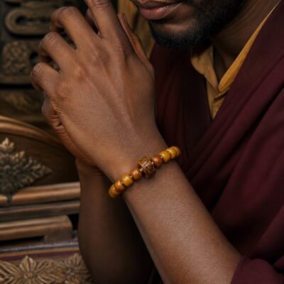 amber-carved-accent-prayer-bracelet-wearing-man Golden Ember Carved Accent Prayer Bracelet
