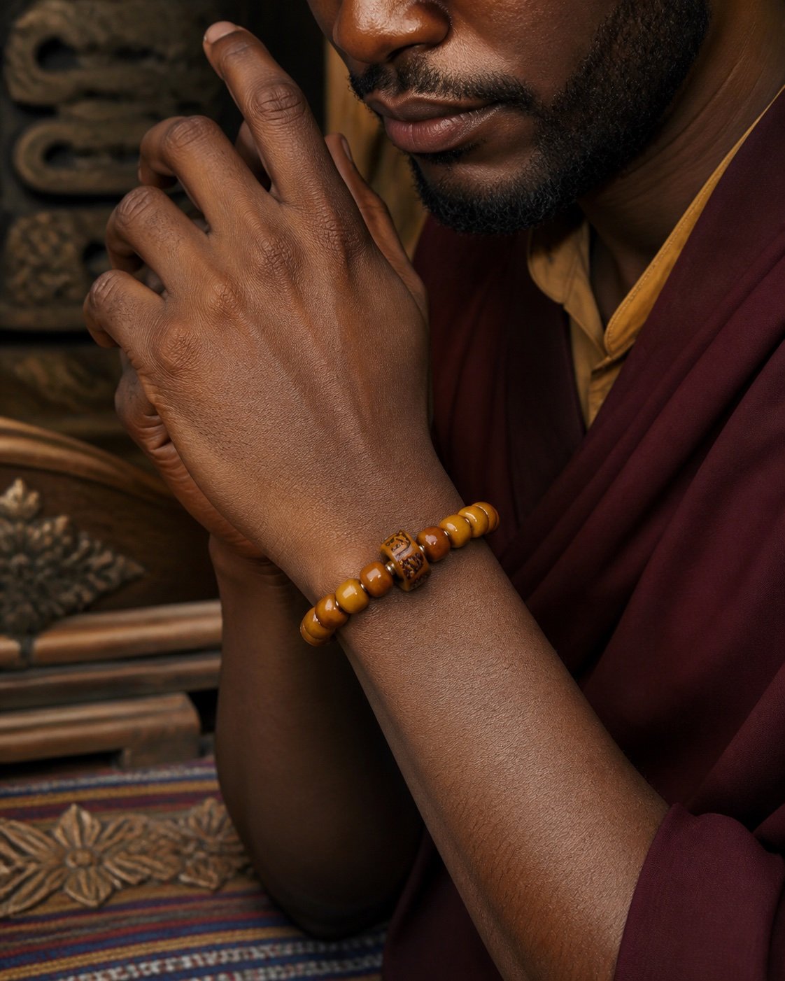 amber-carved-accent-prayer-bracelet-wearing-man Golden Ember Carved Accent Prayer Bracelet