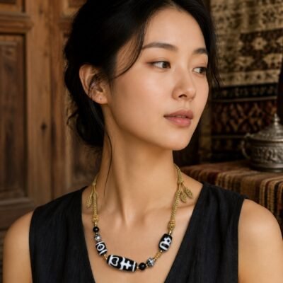 Treasure Vase Dzi Necklace with black-and-ivory 38 mm focal bead and adjustable cord