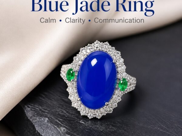 Blue Jade Serenity Ring with an oval blue cabochon, halo of clear accent stones and small green side stones.