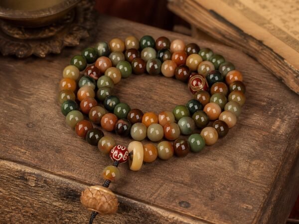 Three-Eye Lotus Mala with 108 jade, amber, and bodhi beads and lotus-inspired terminal