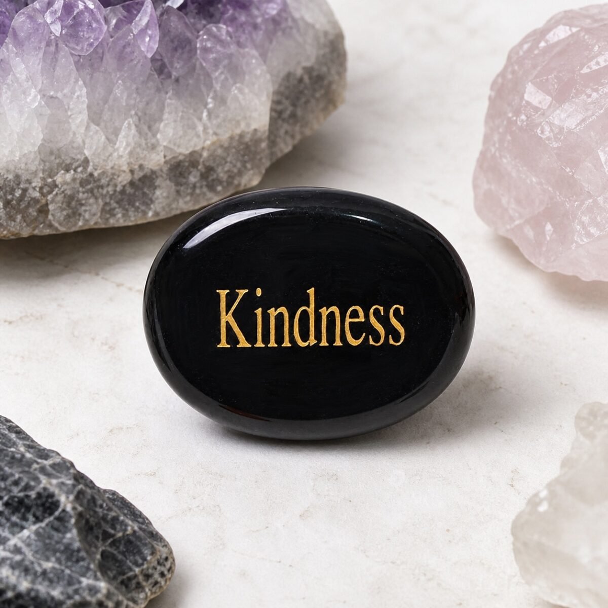 engraved-crystal-intention-palm-stone-collection-black-obsidian-kindness-01-main Black obsidian palm stone engraved with Kindness