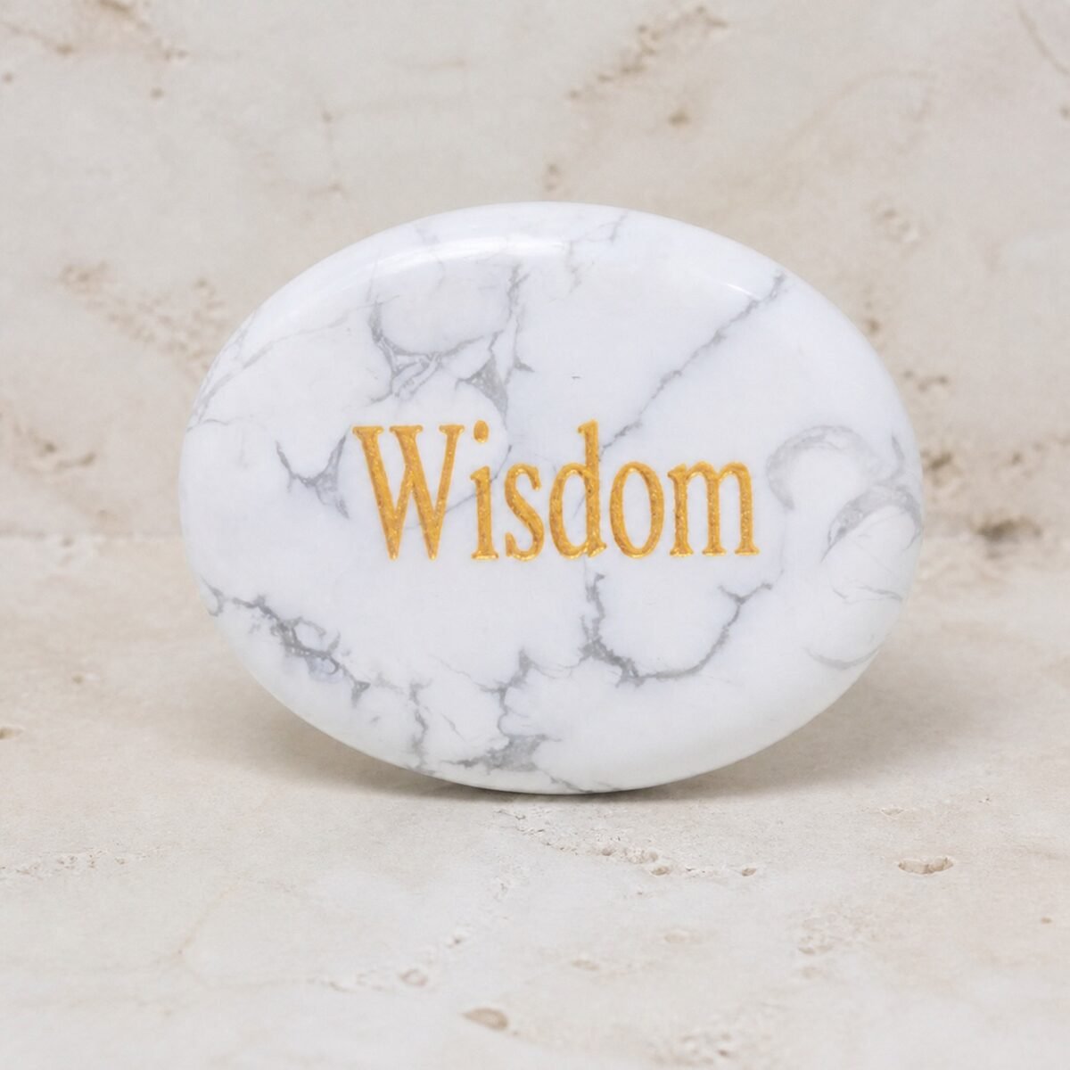 Howlite palm stone engraved with Wisdom