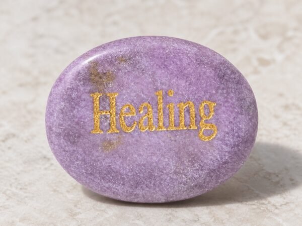 Lepidolite palm stone engraved with Healing