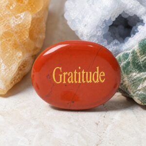 Red jasper palm stone engraved with Gratitude
