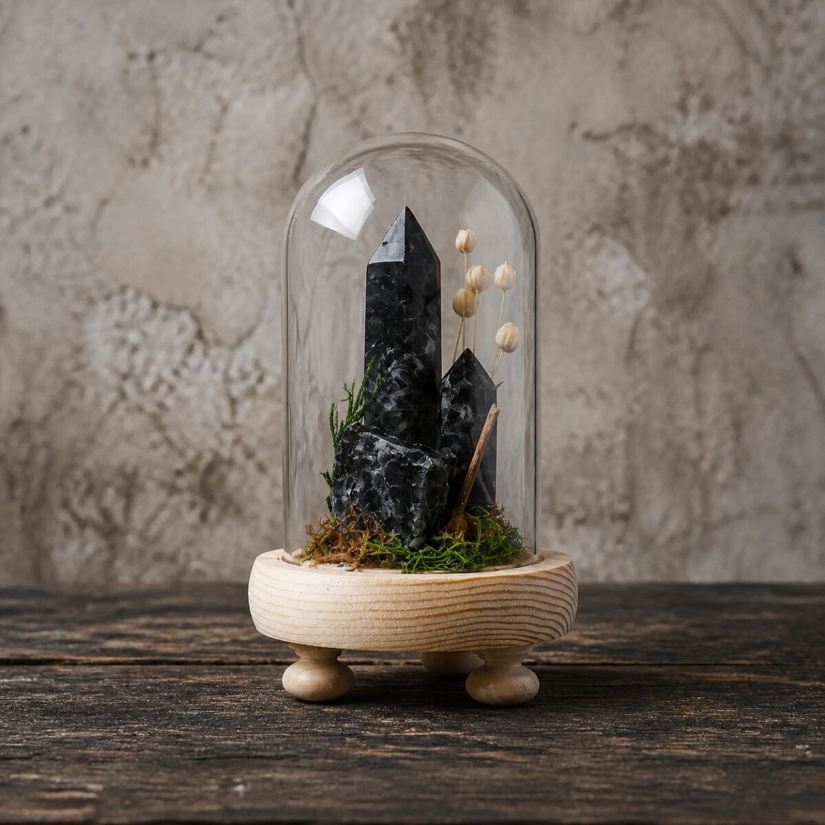 Black Moonstone Dome with natural black moonstone moss and dried botanicals beneath a glass dome