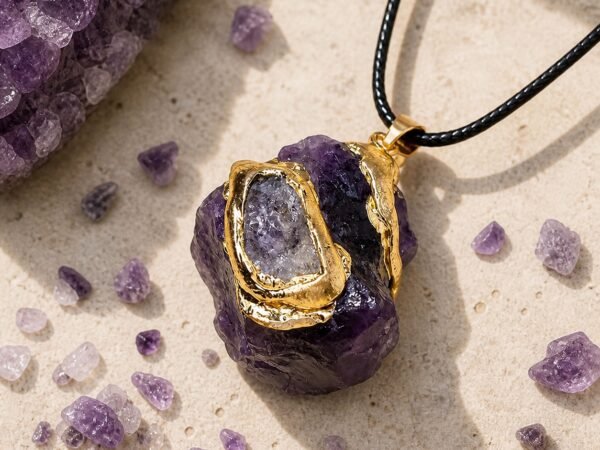 Amethyst raw crystal pendant with gold-tone wrap and black hand-braided cord