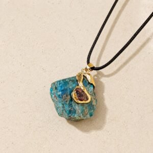 Blue apatite raw crystal pendant with gold-tone wrap and black hand-braided cord