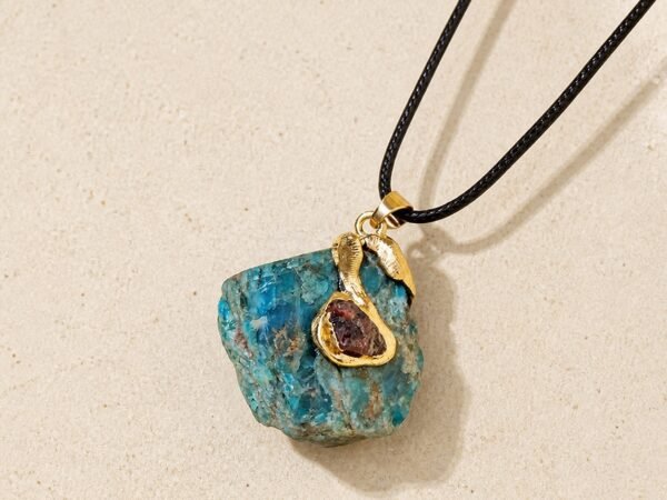 Blue apatite raw crystal pendant with gold-tone wrap and black hand-braided cord