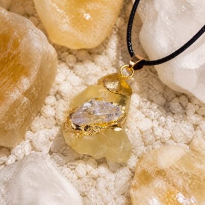 Citrine raw crystal pendant with gold-tone wrap and black hand-braided cord