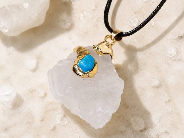 gold-wrapped-raw-crystal-talisman-pendant-collection-clear-quartz-01-main Gold wrapped raw crystal pendant in clear quartz with gold-tone wrap and black leather cord