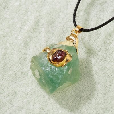 Green fluorite raw crystal pendant with gold-tone wrap and black hand-braided cord