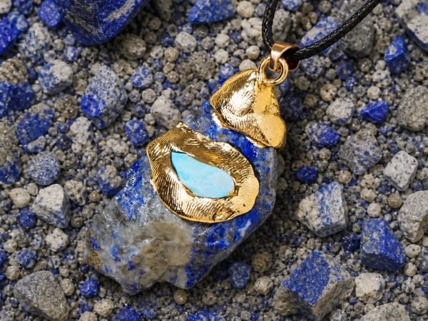 Lapis lazuli raw crystal pendant with gold-tone wrap and black hand-braided cord