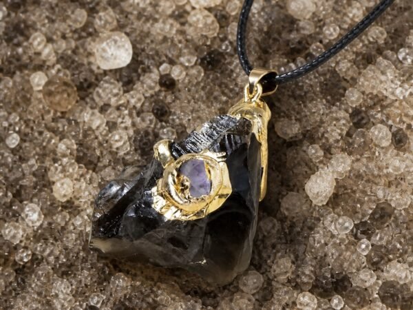 Smoky quartz raw crystal pendant with gold-tone wrap and black hand-braided cord