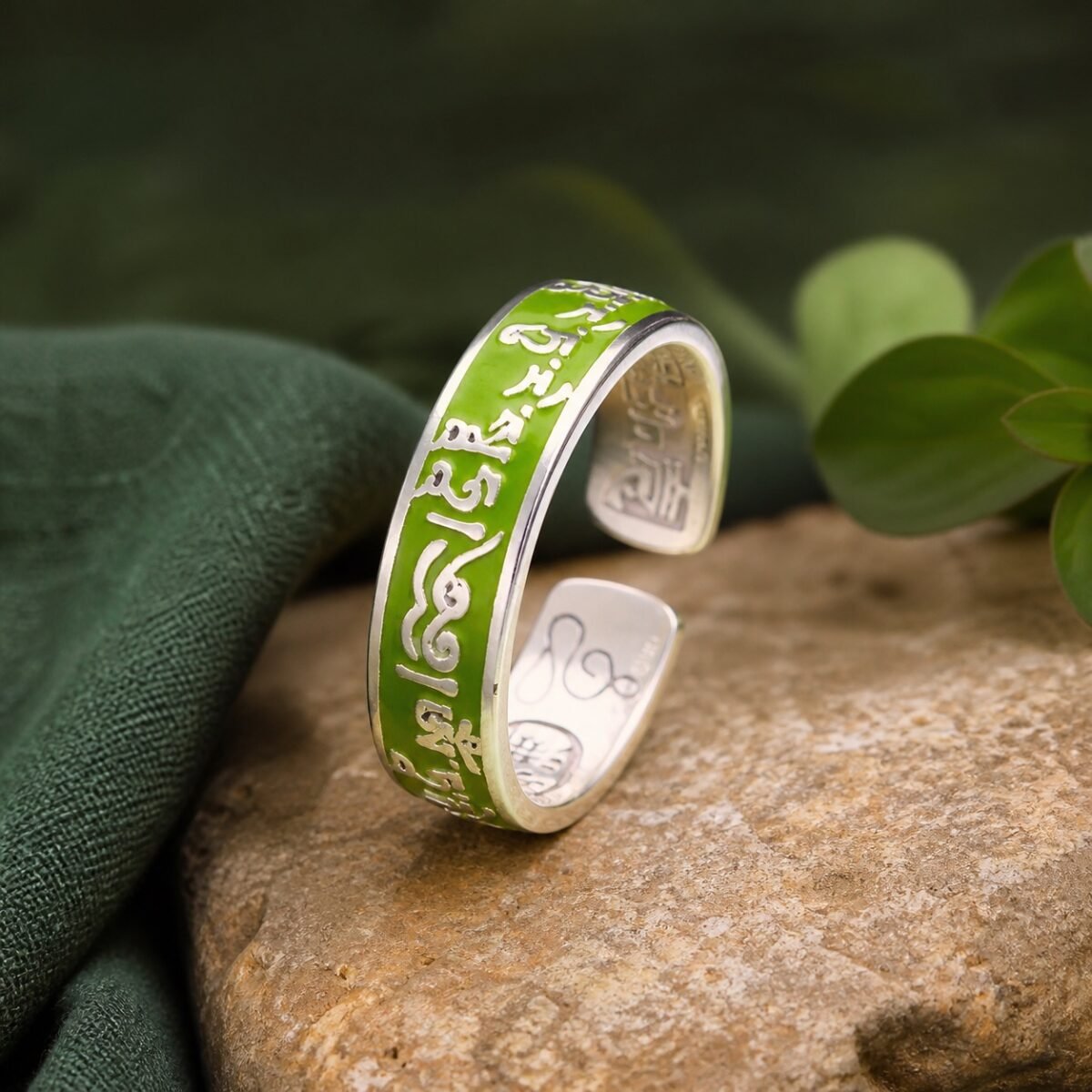 green-tara-protection-mantra-ring-01-main Green Tara mantra ring with raised copper details beneath a colored resin dome