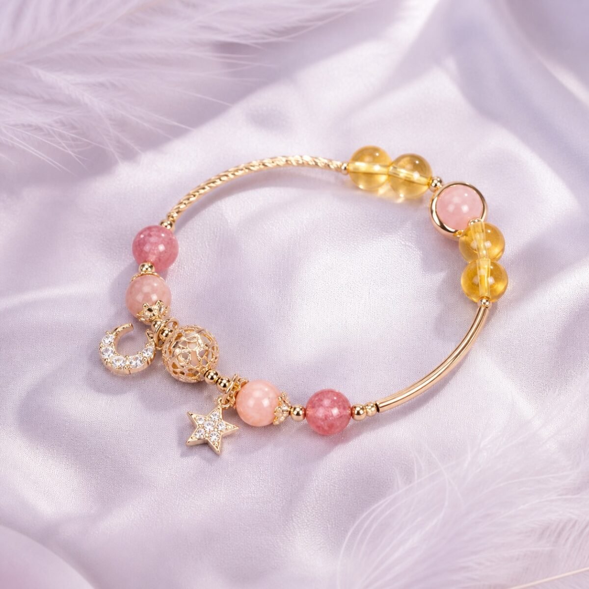 Citrine star bracelet with hollow-orb detail and star-and-moon charms.