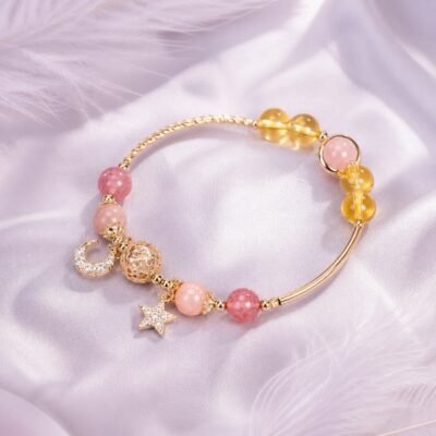 Citrine star bracelet with hollow-orb detail and star-and-moon charms.