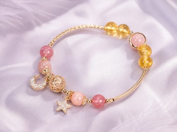 Citrine star bracelet with hollow-orb detail and star-and-moon charms.