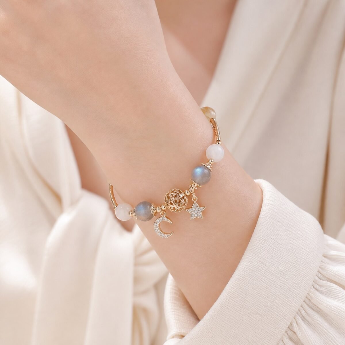 Hollow Orb Rutilated Quartz Moonstone Bracelet