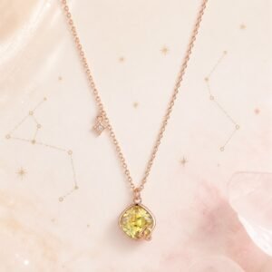 Leo rose gold crystal zodiac necklace with sunny-yellow crystal and Leo glyph