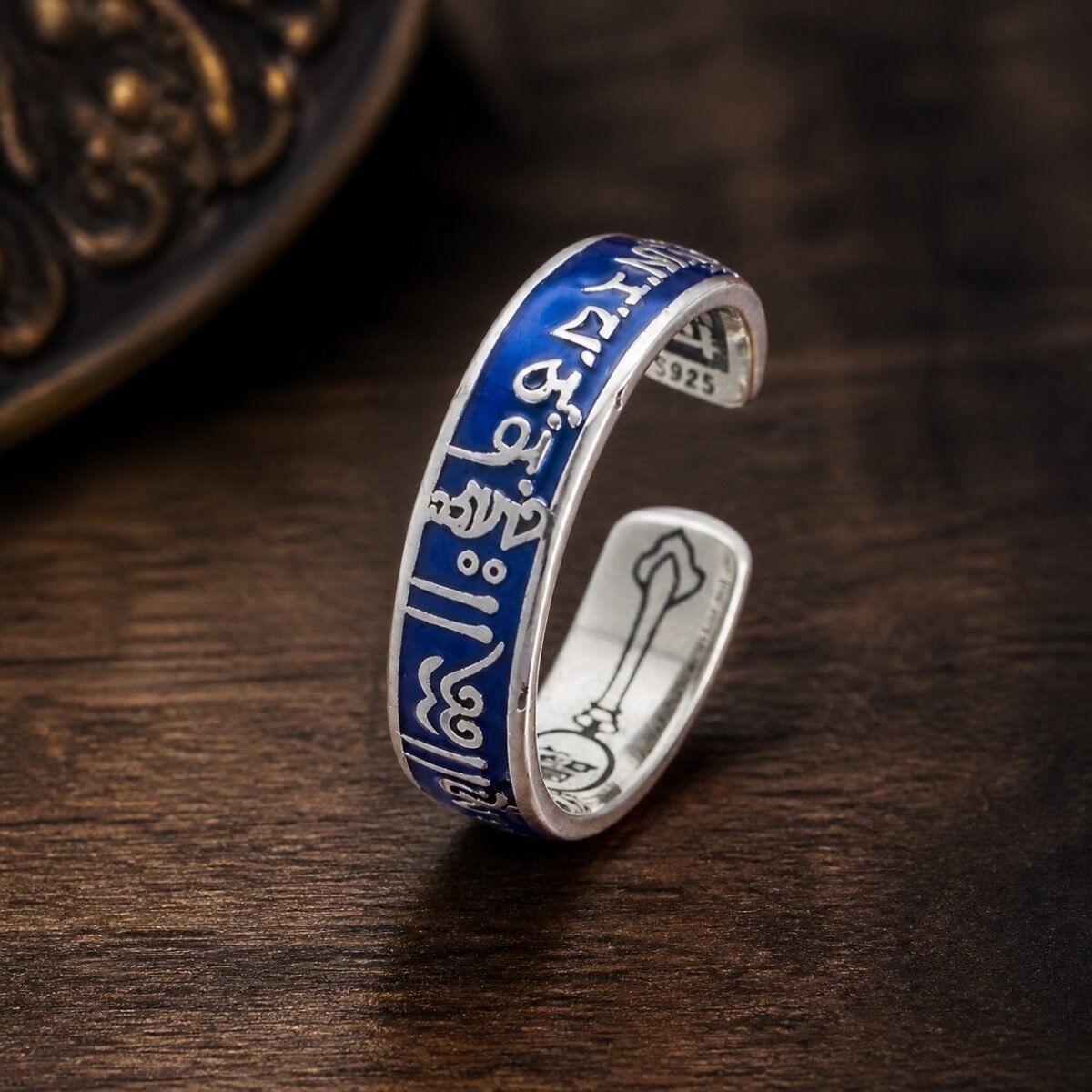 manjushri-wisdom-mantra-ring-01-main Wisdom Mantra Ring with raised mantra-style copper details and a blue resin-dome finish