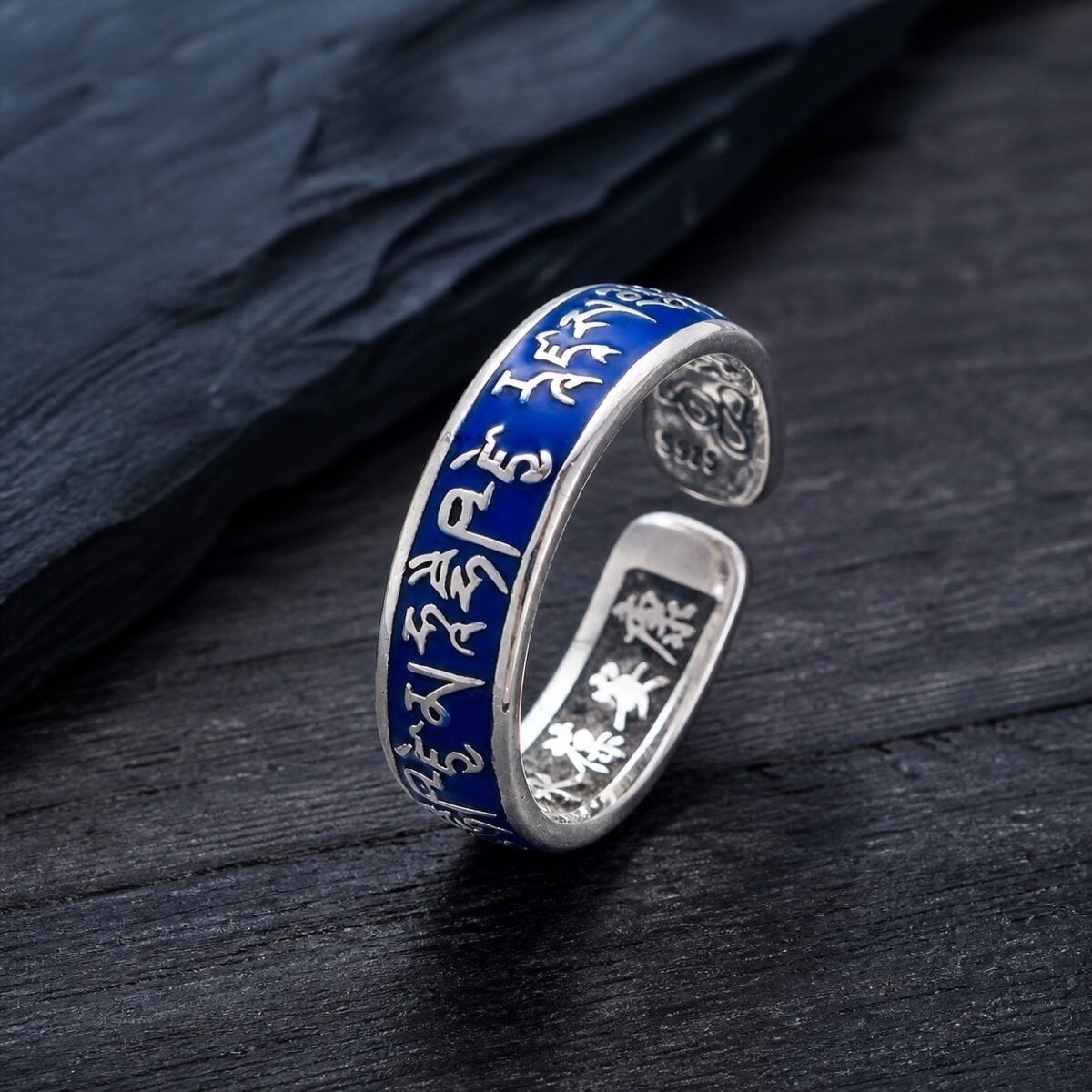 medicine-buddha-healing-mantra-ring-01-main Medicine Buddha ring with raised mantra-style copper details beneath a blue resin dome