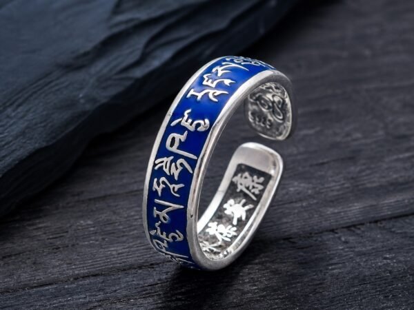 medicine-buddha-healing-mantra-ring-01-main Medicine Buddha ring with raised mantra-style copper details beneath a blue resin dome