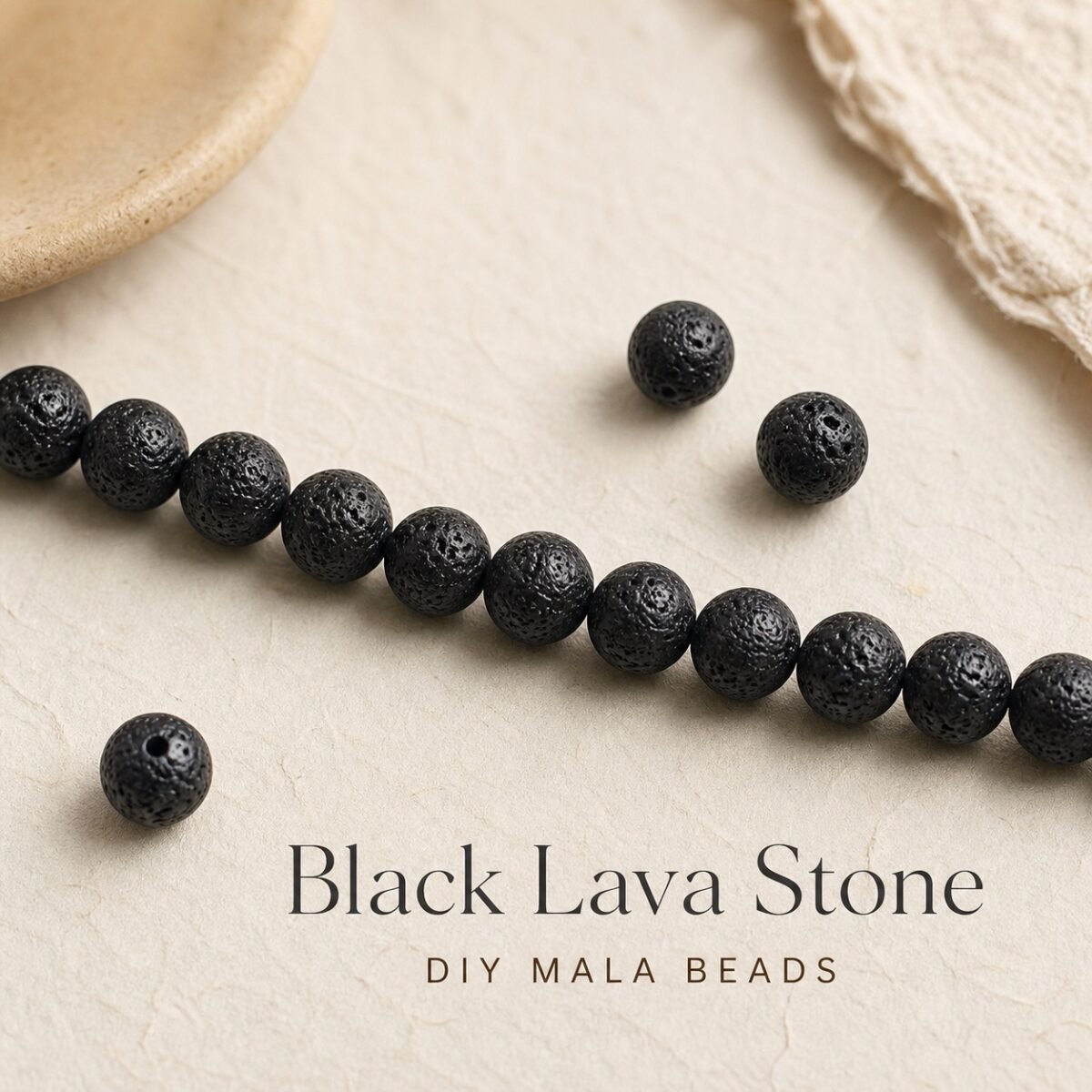 Black lava stone beads arranged for DIY mala making