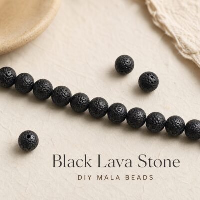 Black lava stone beads arranged for DIY mala making