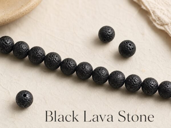 premium-black-lava-stone-loose-beads-diy-mala-text-main Black lava stone beads arranged for DIY mala making