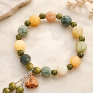 Prosperity Lotus Bracelet with green sandalwood-style beads and a carved lotus-pod charm