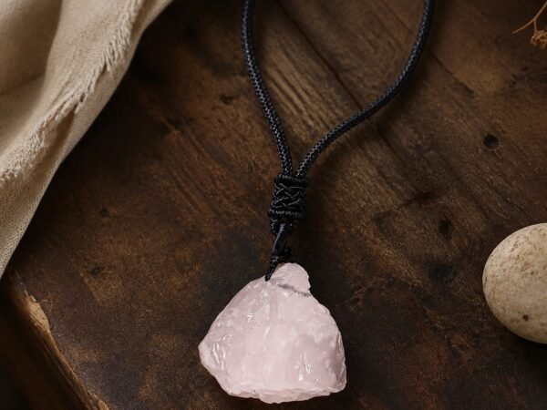 Rose quartz raw crystal pendant with adjustable black braided cord