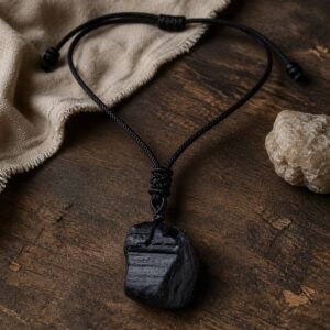 Black obsidian raw crystal pendant on adjustable black braided cord