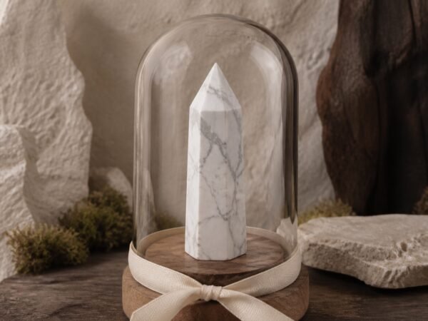 ribbon-crystal-dome-gardens-04-white-stone White Stone crystal point beneath a clear glass dome with a decorative ribbon and gold-tone base