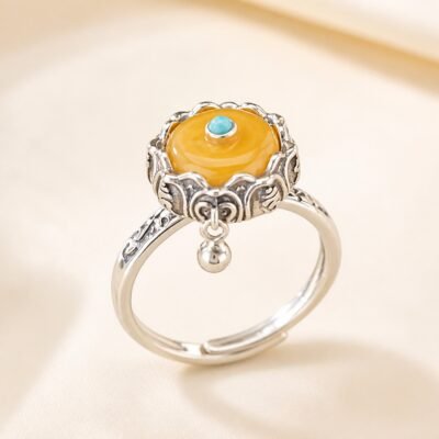 Rotating Prayer Wheel Protection Ring with amber centerpiece and S925 sterling silver band