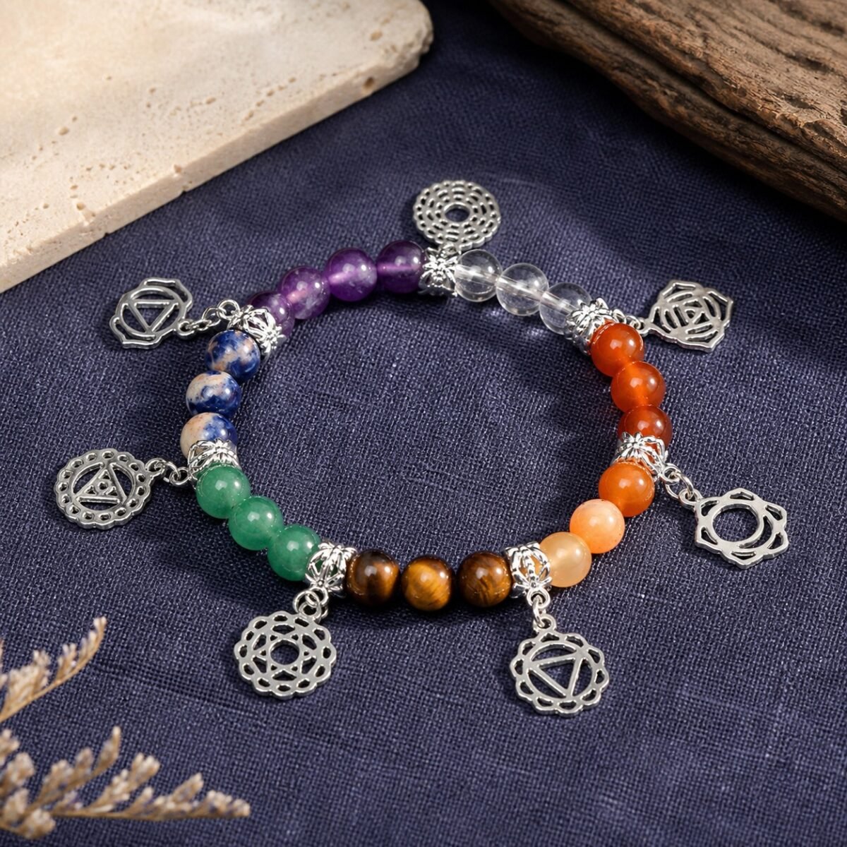 Seven chakra symbol charm bracelet with seven-colour rough-stone crystal beads and dangling charms