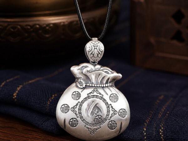 silver-plated-fortune-pouch-amulet-necklace-01-main-hero Fortune Pouch Necklace with S999 fine-silver pendant and antiqued finish