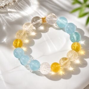 Sunlit Calm aquamarine bracelet with yellow apatite, yellow fluorite, and carved clear quartz beads