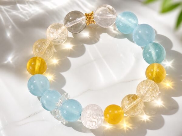Sunlit Calm aquamarine bracelet with yellow apatite, yellow fluorite, and carved clear quartz beads