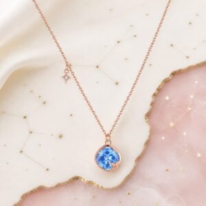 Taurus rose gold crystal zodiac necklace with sapphire-blue crystal and Taurus glyph