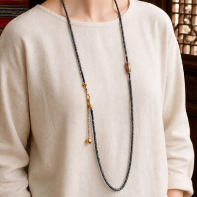 tibetan-inspired-braided-pendant-cord-necklace-blue-wearing-light-skin Tibetan Braided Talisman Cord