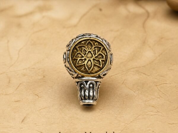 Metal mala spacer charms with a lotus mandala in antique silver and gold tones
