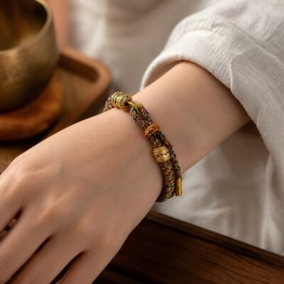 tibetan-six-syllable-mantra-bracelet-01-main-hero Six-Syllable Mantra Bracelet with hand-braided cotton cord and mantra bead