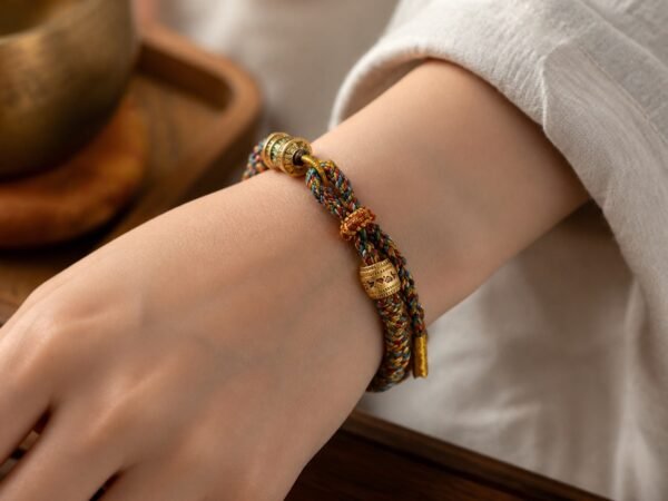 Six-Syllable Mantra Bracelet with hand-braided cotton cord and mantra bead