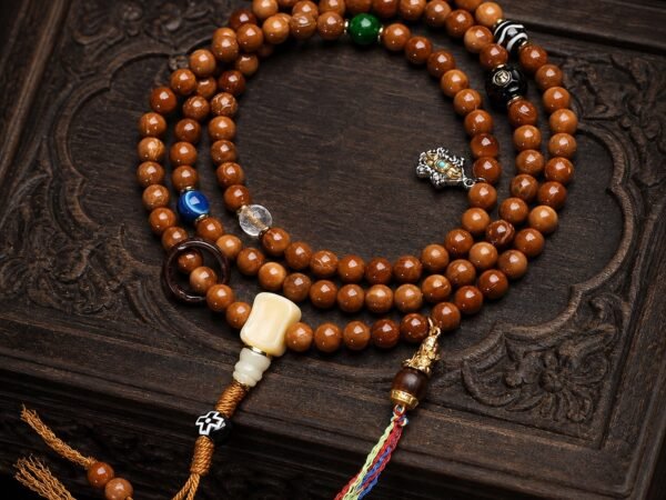 warm-amber-tone-108-bead-tibetan-style-prayer-mala-main Golden Hour Prayer Mala with 108 amber-brown beads, agate accents, and multicolour tassel