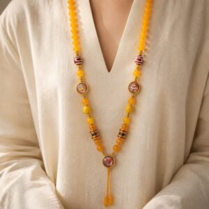Yellow Agate Thangka Pendant Chain worn, showing striped prayer beads and tassel