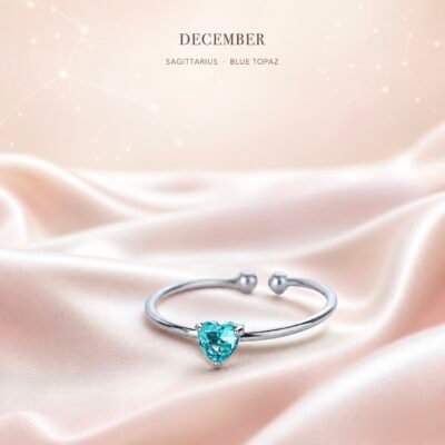 Blue gemstone birthstone heart ring with silver-tone adjustable band